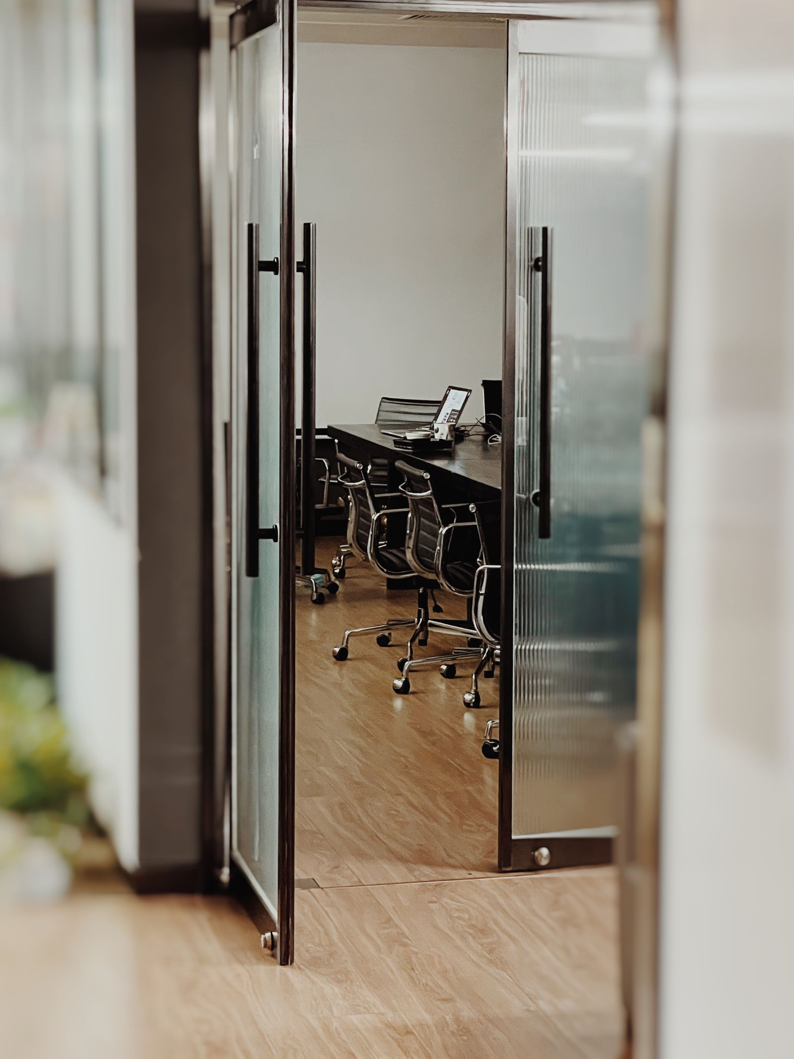 Meeting room behind fluted glass doors
