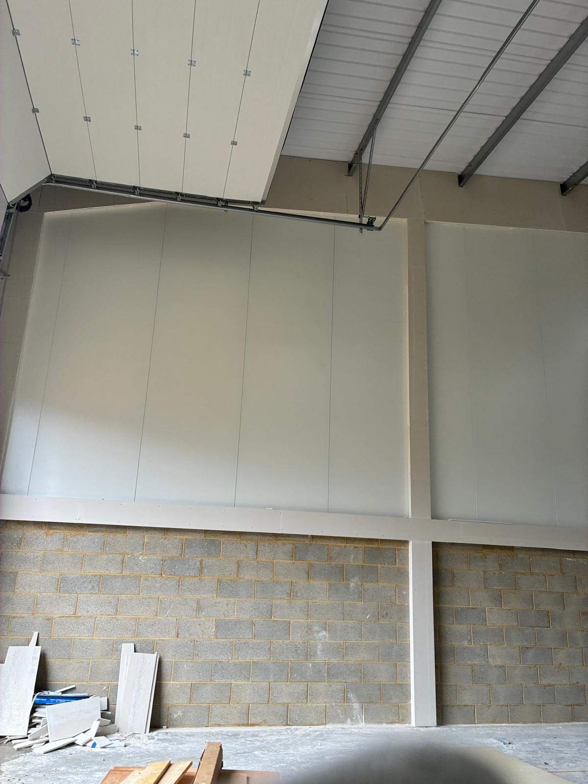 Wall lining and bulkhead detail in the corner of the warehouse unit