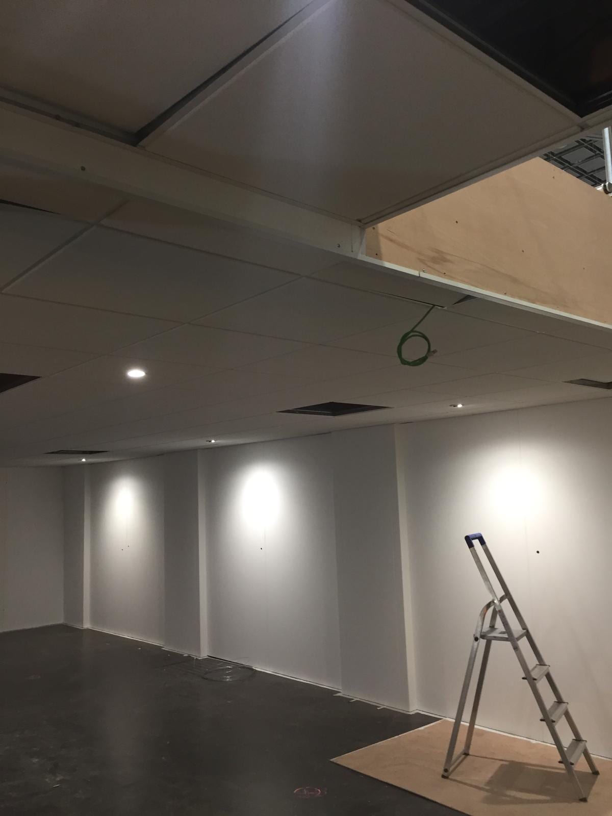 Plastered walls and feature ceiling detail in the stand meeting area
