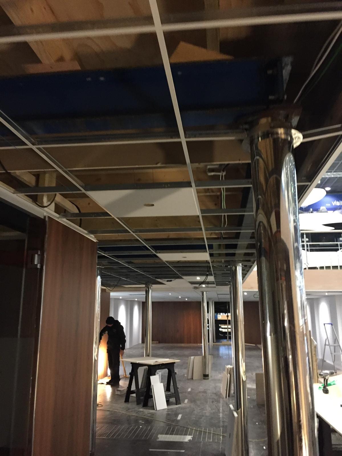 Ceiling grid and timber panelling under construction on the stand