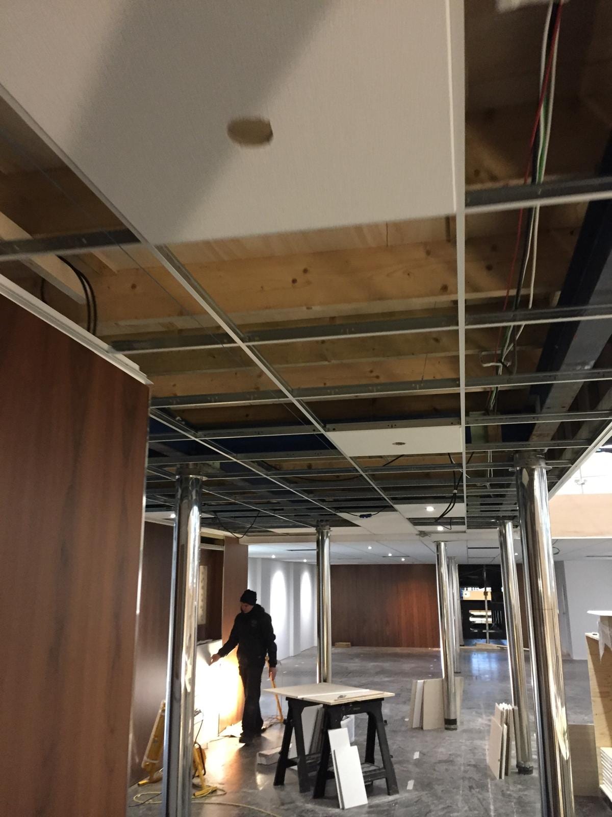 Stand interior with the ceiling grid in place and panelling being fitted
