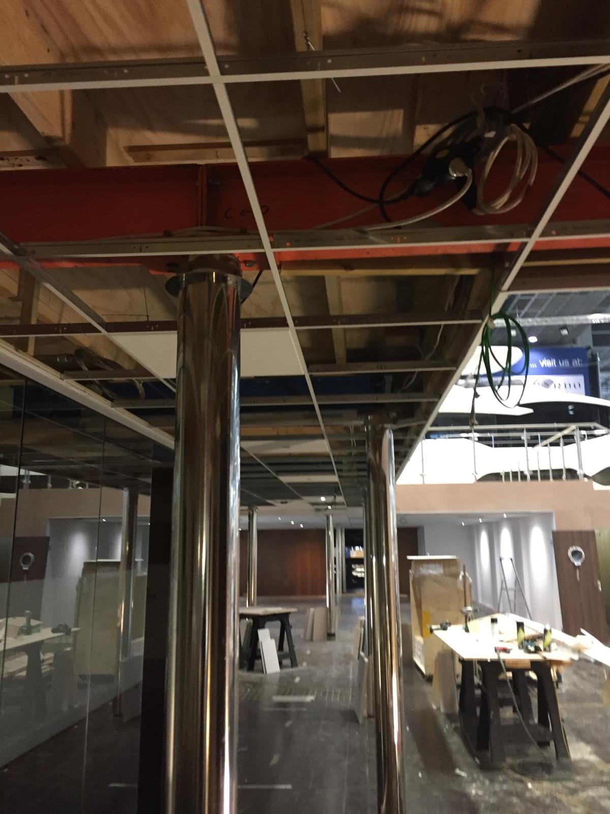 Services and ceiling grid above the stand walkway