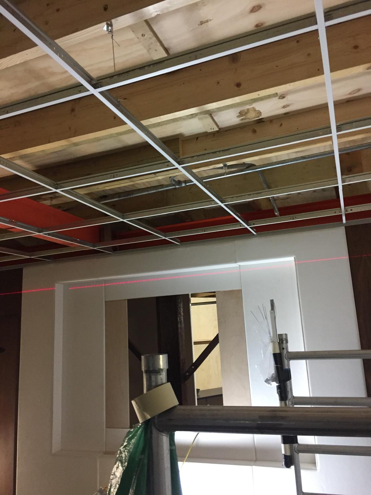 Ceiling grid and bulkhead detail above a doorway on the stand