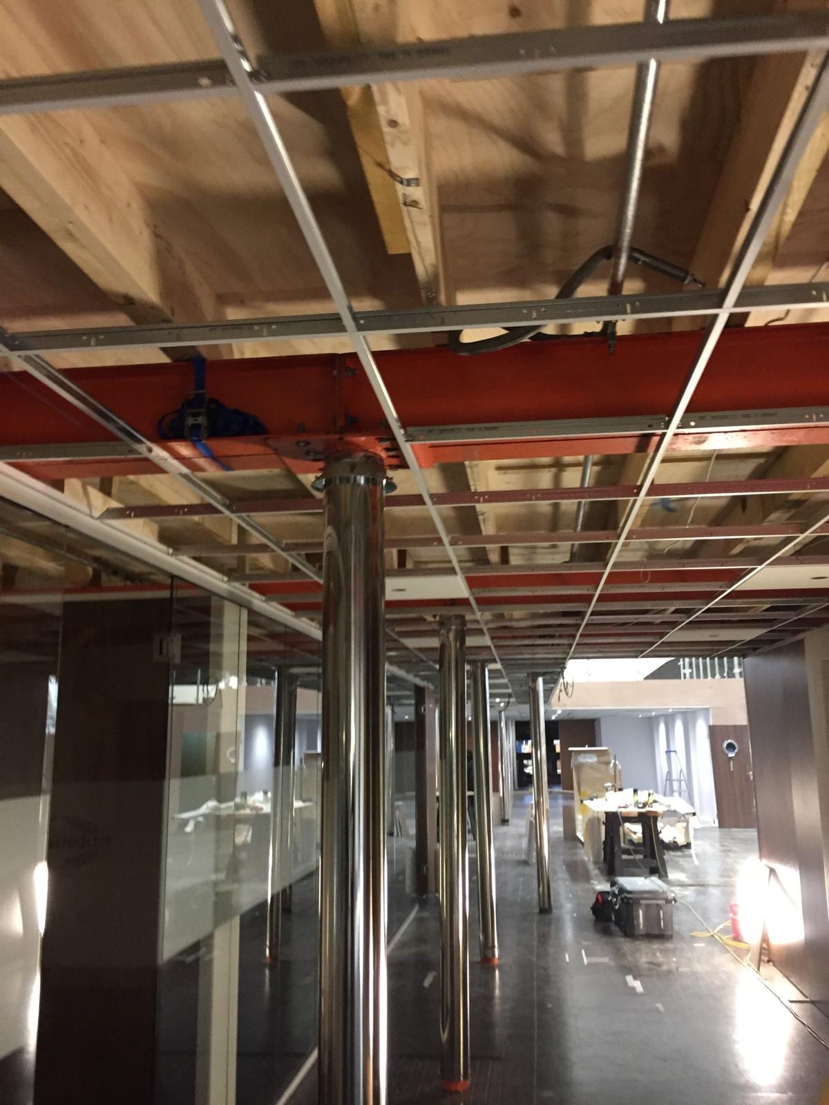 Long view down the stand corridor with the ceiling grid installed