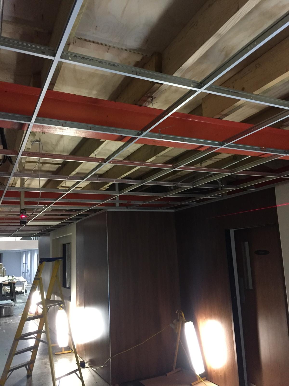 Ceiling grid and timber panelling towards the end of the stand
