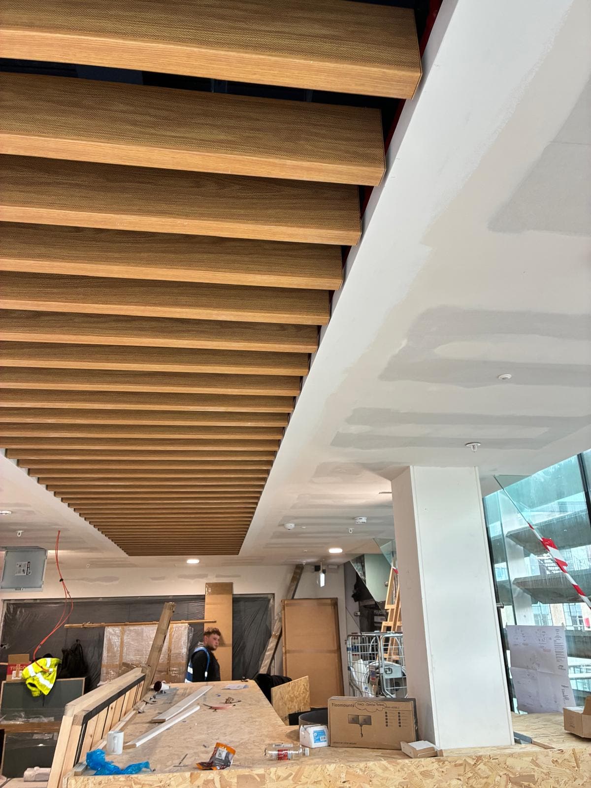 Timber baffles and curved plaster bulkhead above the work in progress