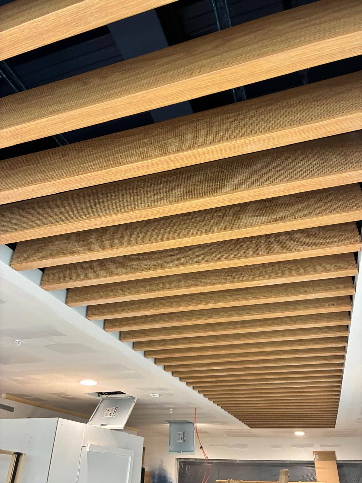 Timber baffle ceiling with the counter carcass built out below