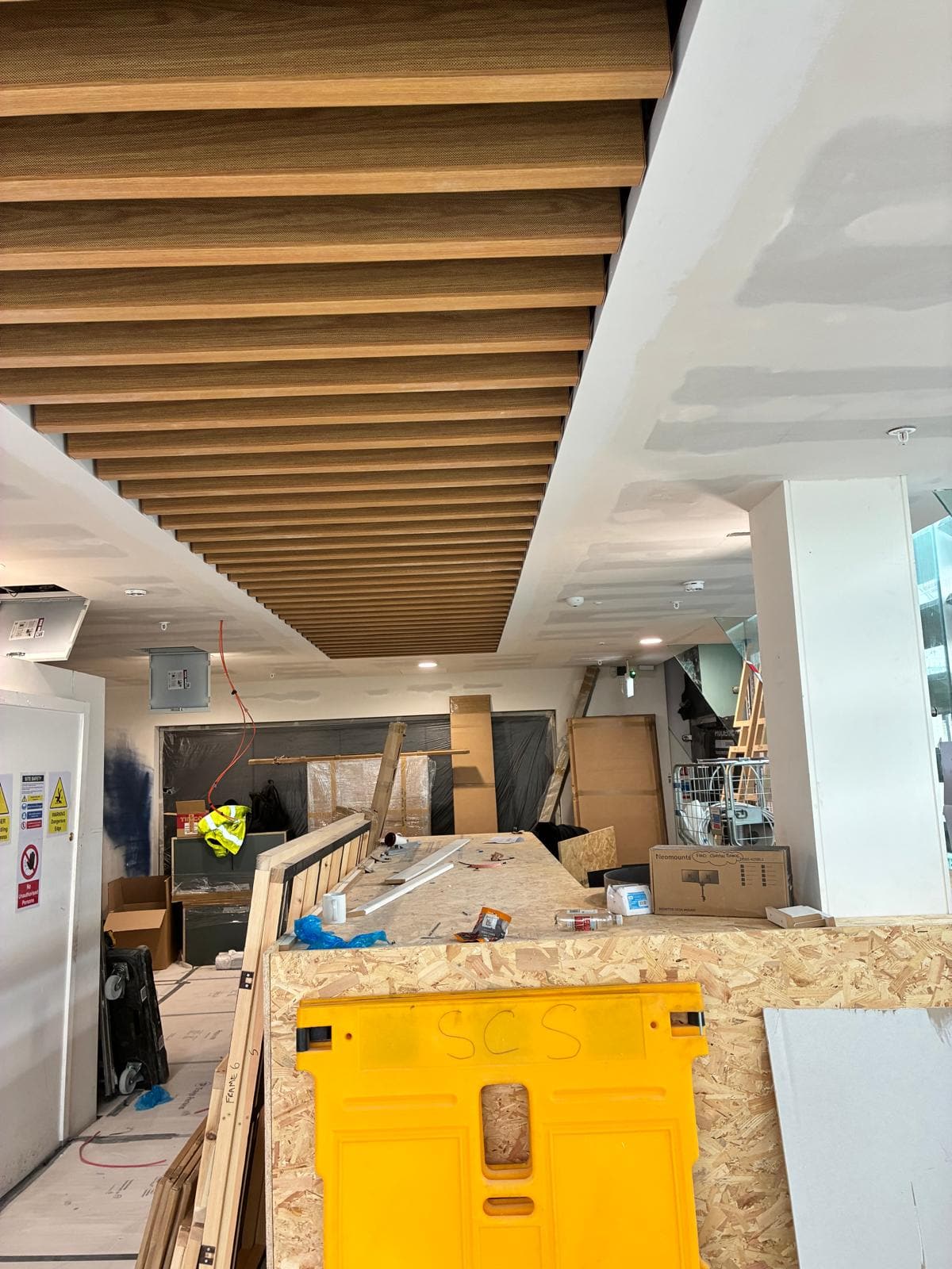 Plastered bulkheads and timber baffles above the part built counter