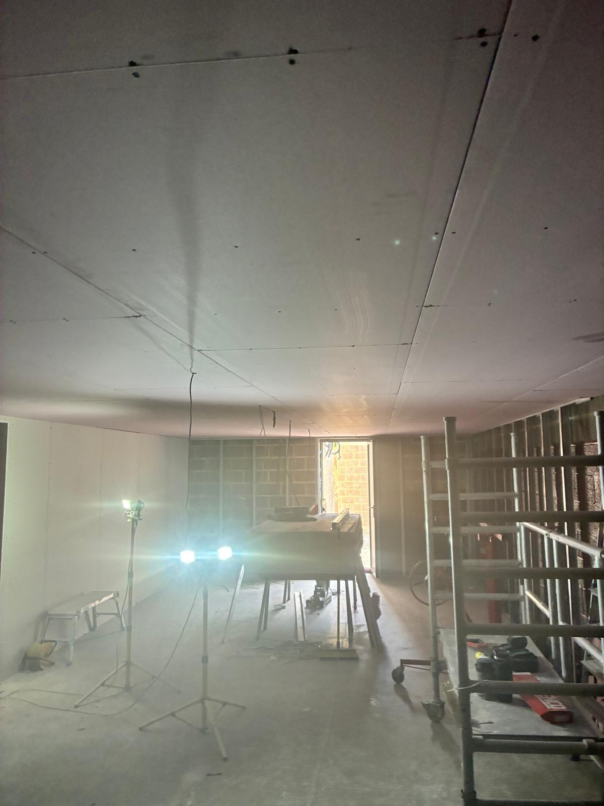 Room boarded out with the ceiling complete and stud partitions in place